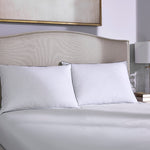 Supportive Down Pillow against headboard