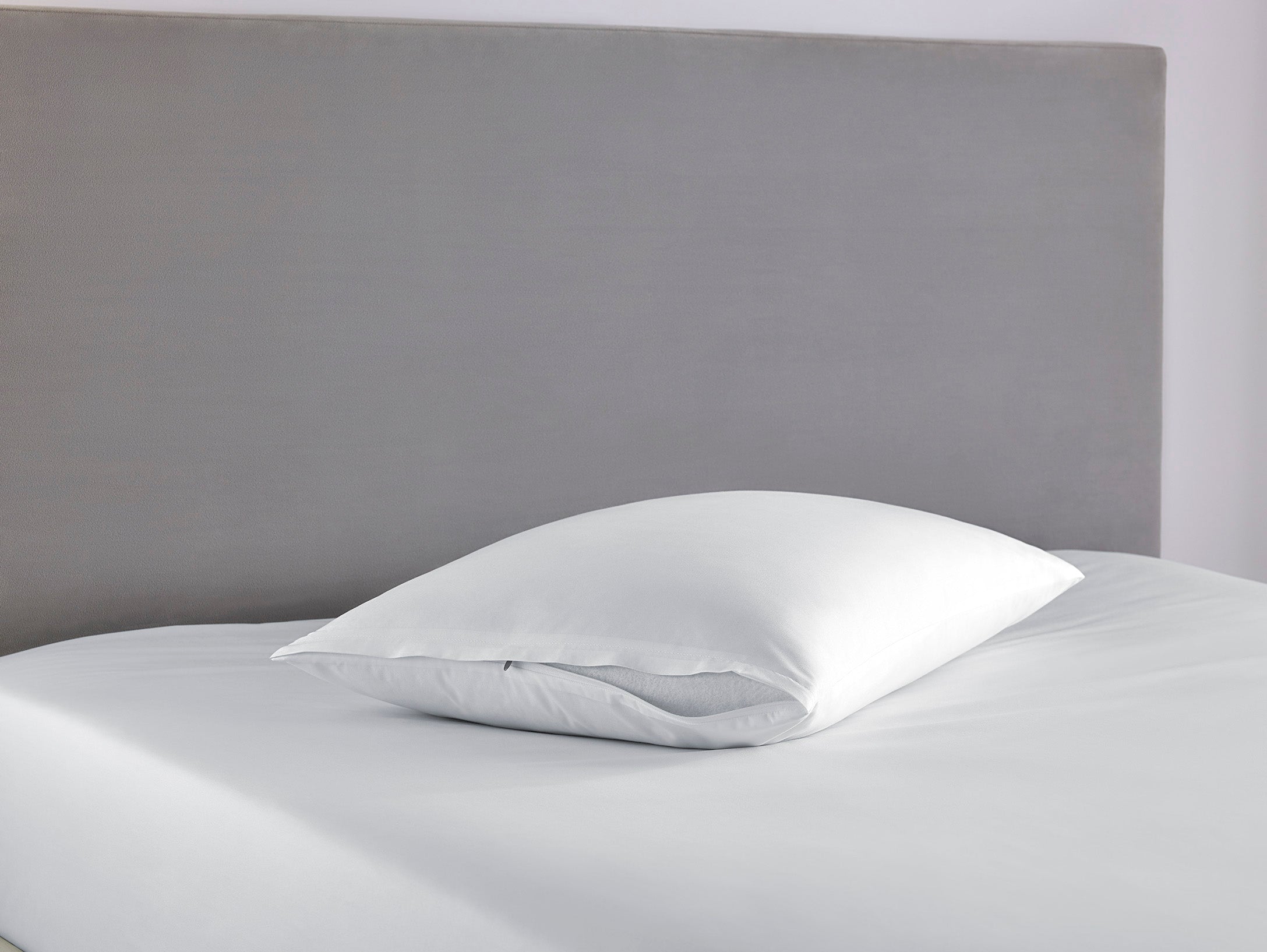 SmartGuard Pillow Protector on bed